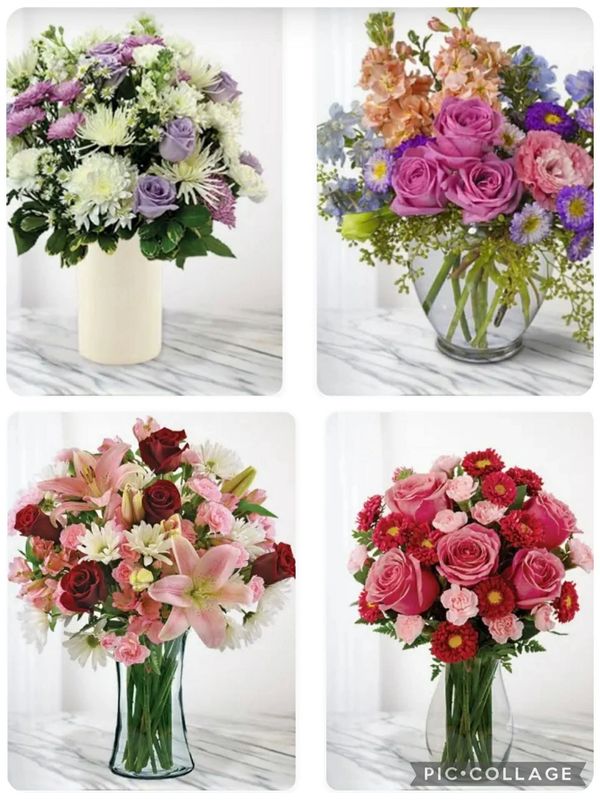 Four elegant floral bouquets in different vases on a marble surface.