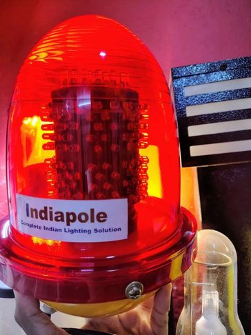 Red warning light labeled Indiapoled with LED bulbs inside.