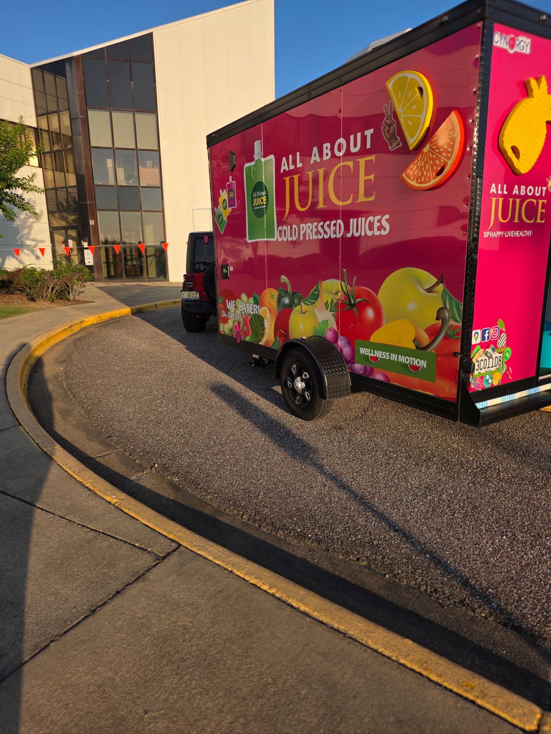 All About Juice pink cold-pressed juice trailer at EastChase in front of Marshalls in Montgomery, Al