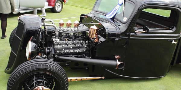 The black and copper 1936 modified Ford truck at Cobble Beach,