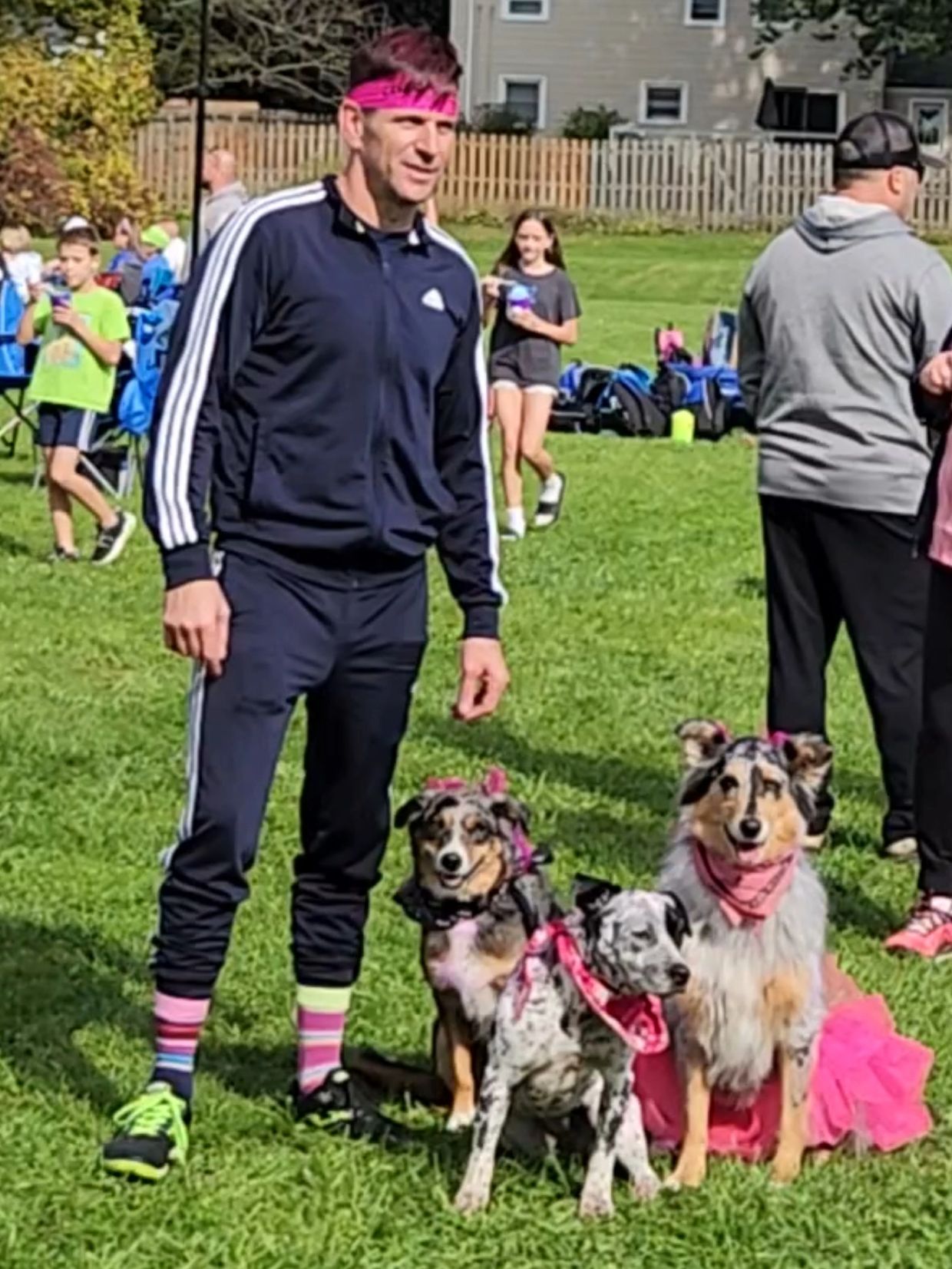 Matt Kron with his no leash trained dogs at a soccer tournament in Rochester NY.