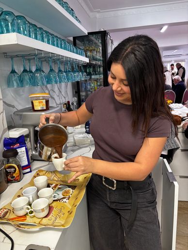Martha Kallafatis serving up Greek Coffee at the Club.