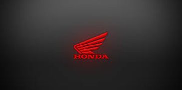 Red Honda wing logo on a dark background.