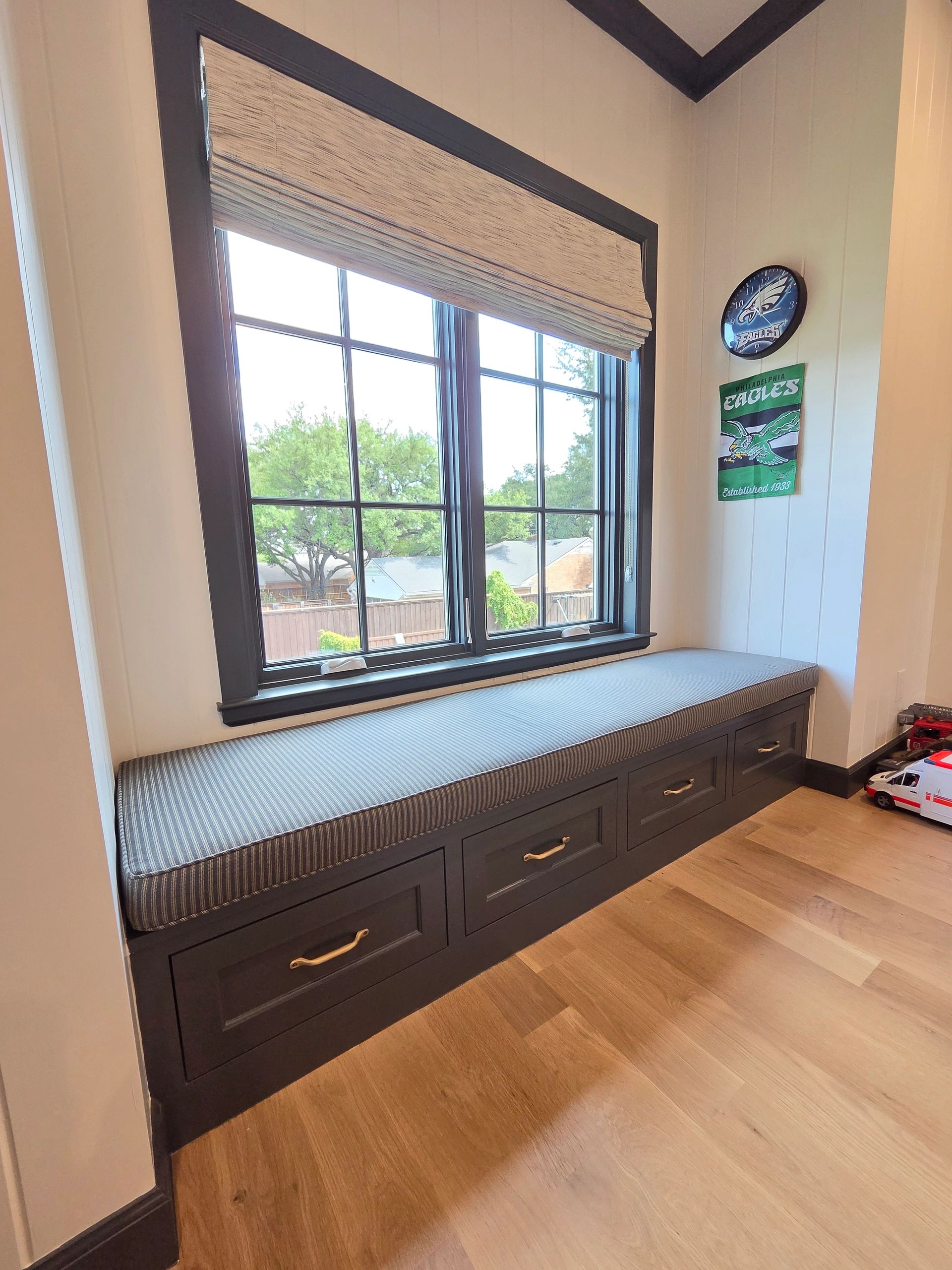Custom window seat bench cushion upholstered in designer fabric in a Dallas home.