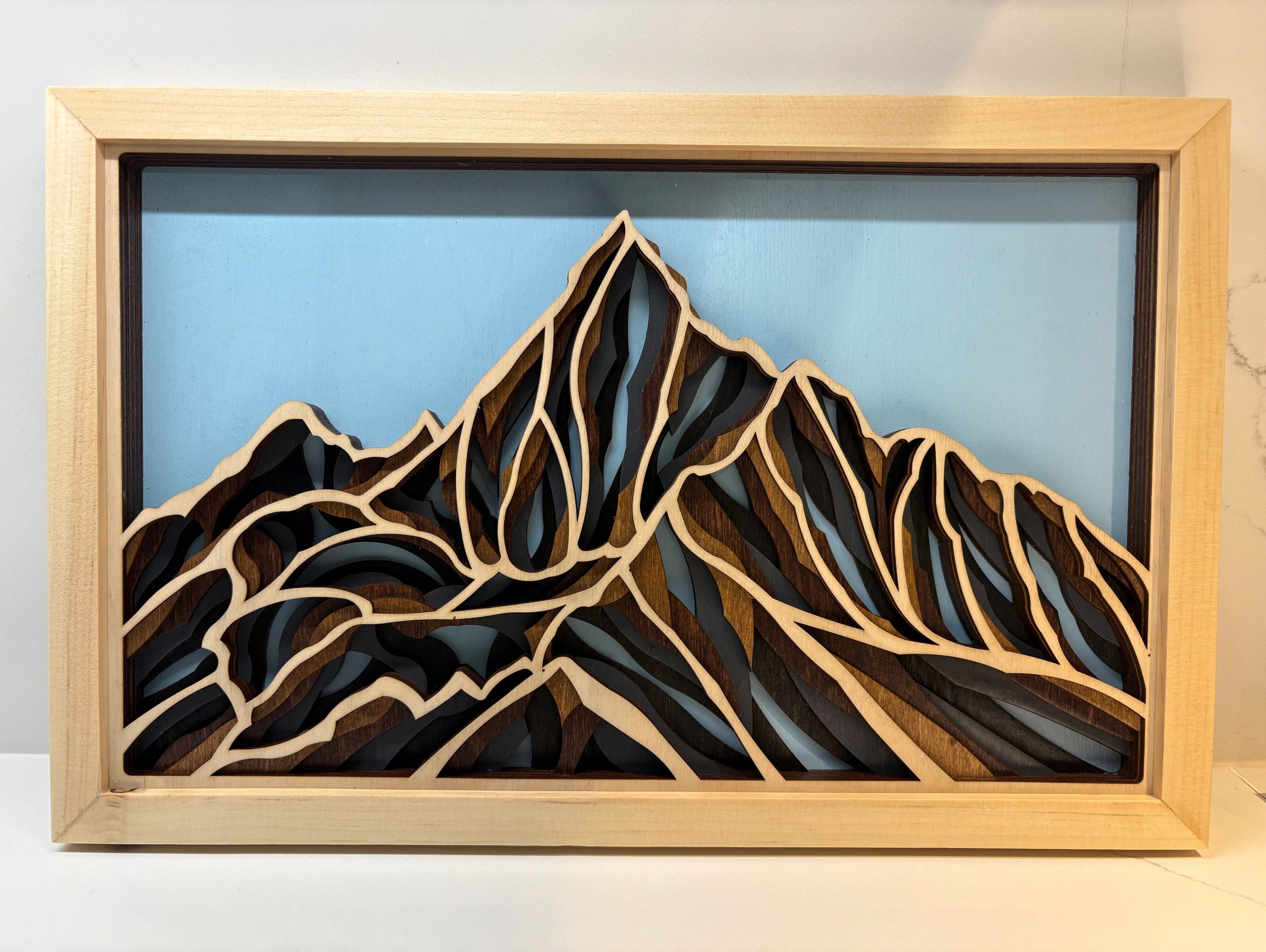 Multi layer wood art of Mountains.