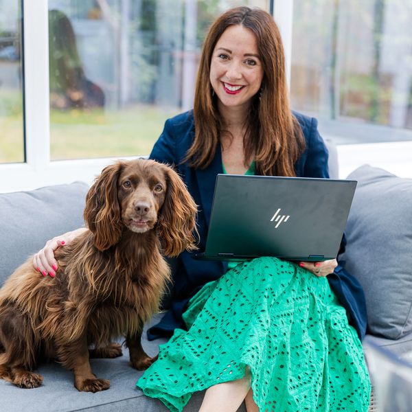 Me with my dog in my house smiling 