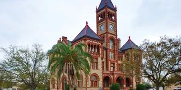 Historic red-brick courthouse with a clock tower.