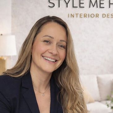 Smiling woman with long hair in a professional setting.