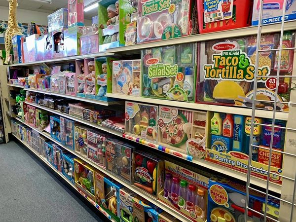 Fully stocked pharmacy retail aisle.