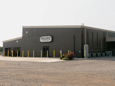 A building with the sign 'Prairie Packing'.