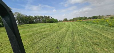 Lush green grass treated with lawn fertilization in Lincoln. NE.