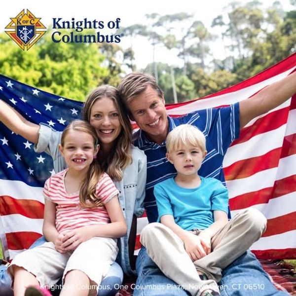 Family smiling with American flag and Knights of Columbus logo.