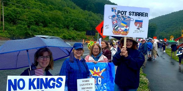 Photo of some of our active volunteers during the No Kings rally in June 2025.