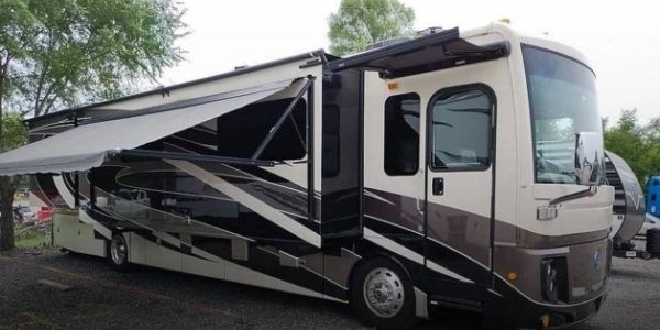 Large recreational vehicle with extended awning.