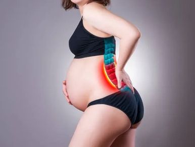 Pregnant woman with highlighted lower back pain.