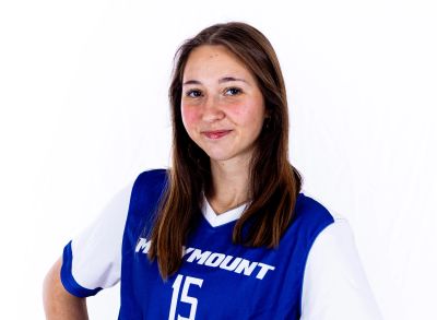 Girl in a blue sports jersey smiling.