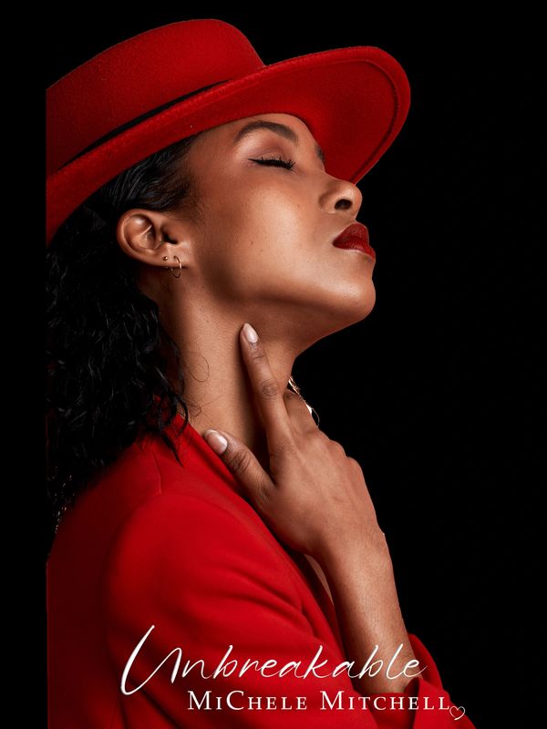 Confident woman in red hat and coat, eyes closed, striking a poised pose.