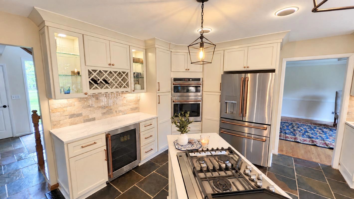 Stylish modern kitchen with white cabinets and stainless steel appliances.
