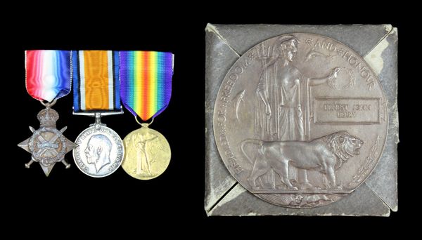 Three military medals and a memorial plaque honoring Ernest Pike Henry.
