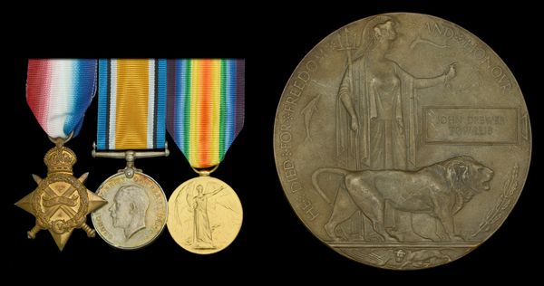 Three military medals and a commemorative medal for John Brewer.