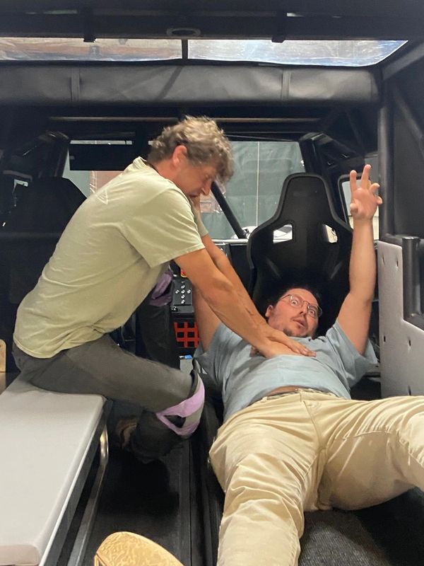 Mike and Trevor pretending to perform CPR in Clemson ICAR's Deep Orange 16  off-road ambulance proje