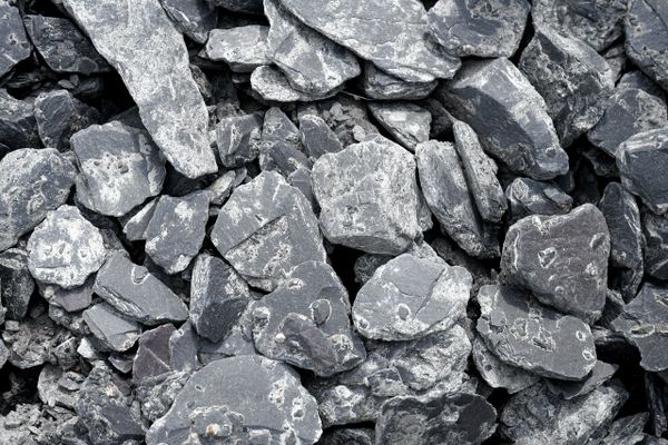 Close-up of gray slate stones piled together.