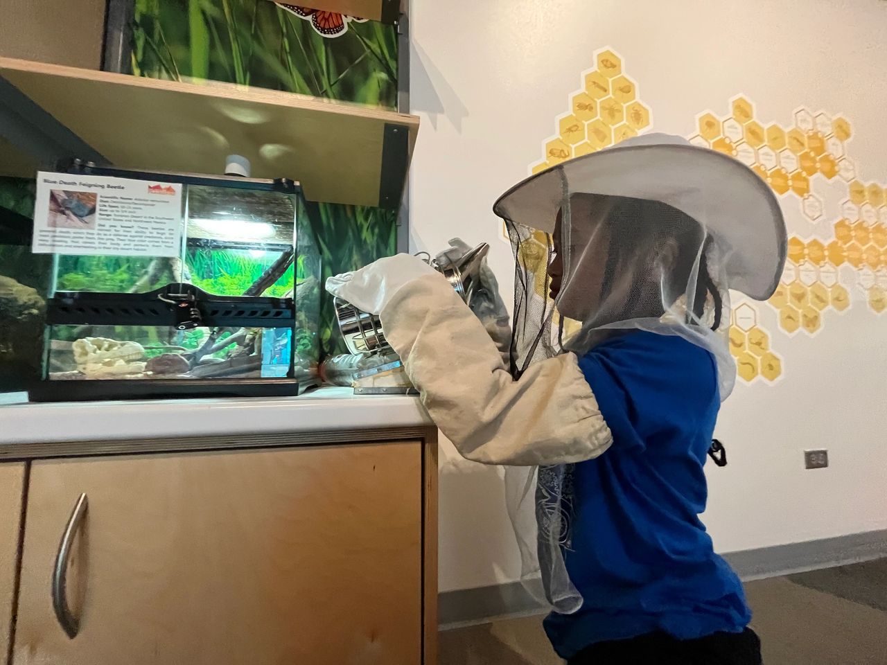 Kai wearing on beekeeper suit