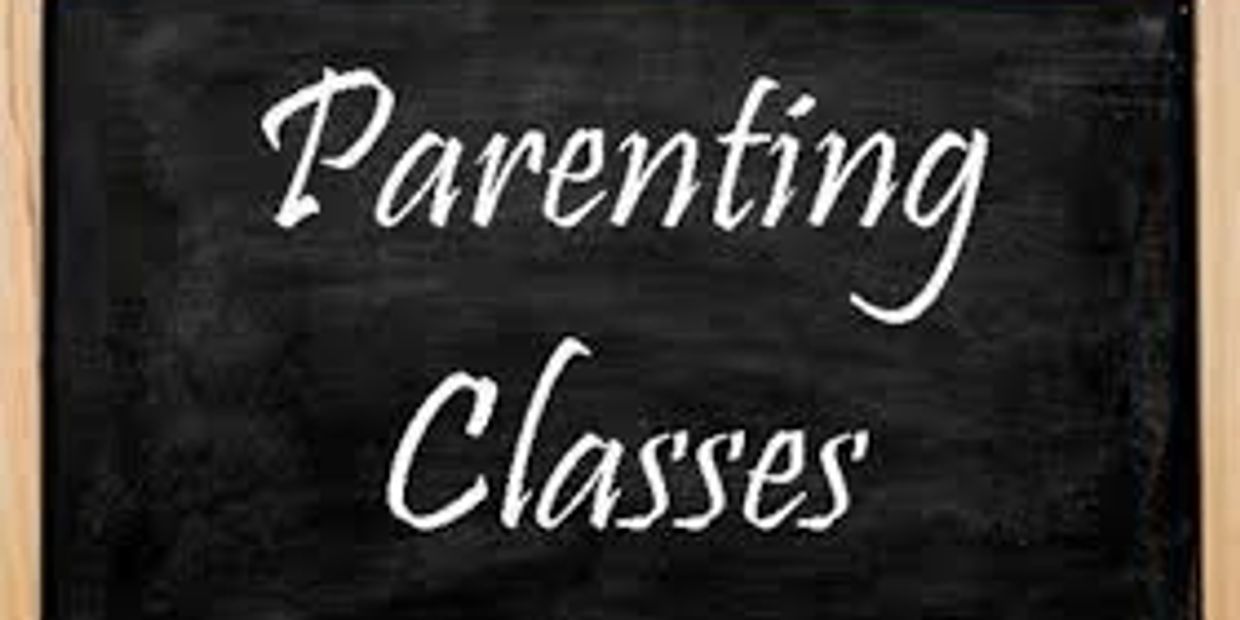 Chalkboard with the words 'Parenting Classes' written in white.