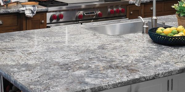 Spacious kitchen island with granite countertop and built-in sink.