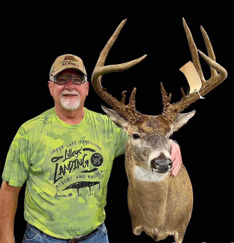 Tim Stidham of Tim's Taxidermy & Wildlife Artistry stands by a whitetail deer shoulder mount. 