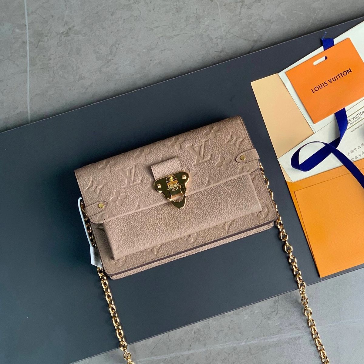Shop Louis Vuitton Vavin chain wallet (M69423) by LESSISMORE☆