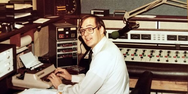 Chuck Wolf in the news studio at KIKK AM-FM Houston where he was News Director and Morning Anchor.