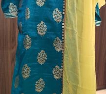 Top pure kota fabric with gota lace, bottom banarasi georgette sharara, dupatta with lace