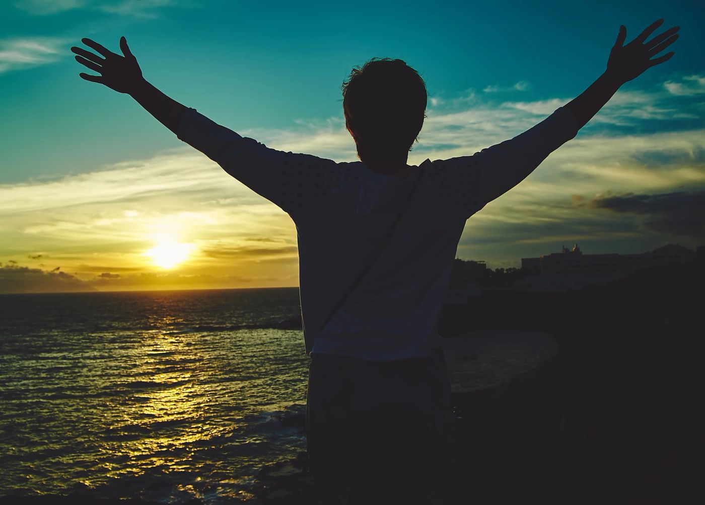 Woman with raised hands in worship