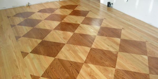 Red Oak Flooring newly finished with a checker board stain pattern ,and top coated with polyurethne