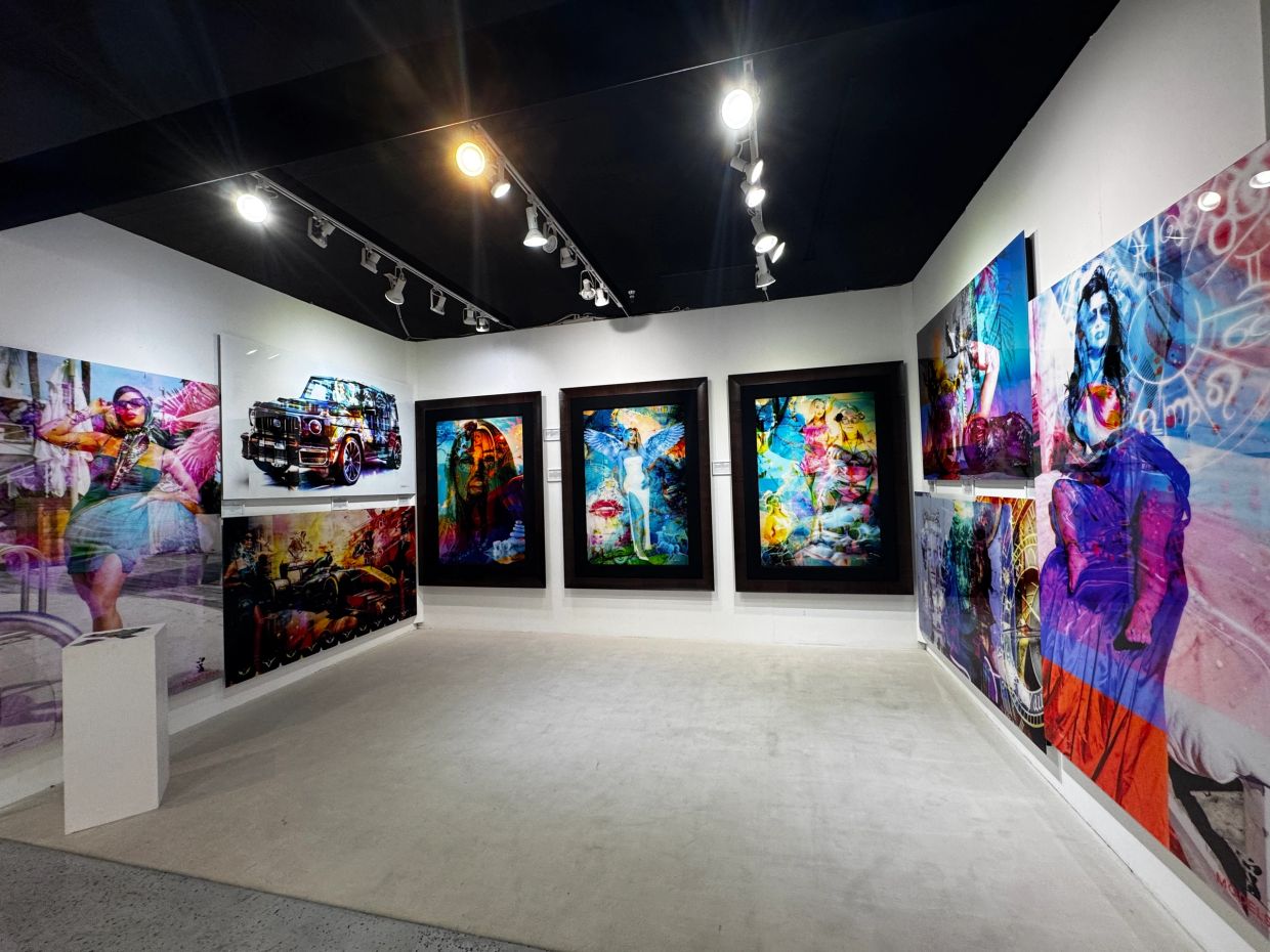 Gallery with vibrant, modern art installations on white walls.