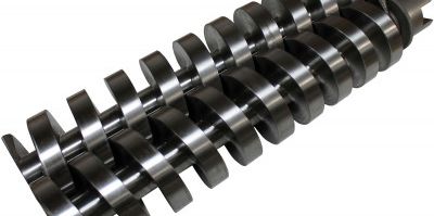 Close-up of metal screw conveyor blades.