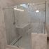 Frameless sliding door glass enclosure polished nickel