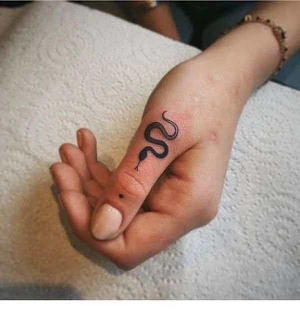 Small snake hand tattoo