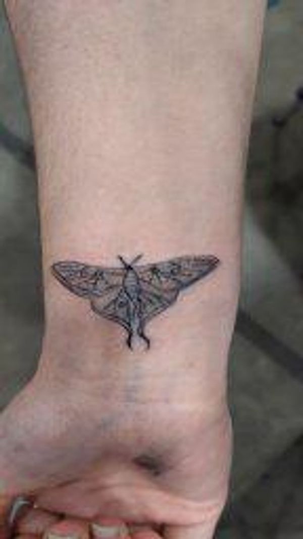 moth wrist tattoo