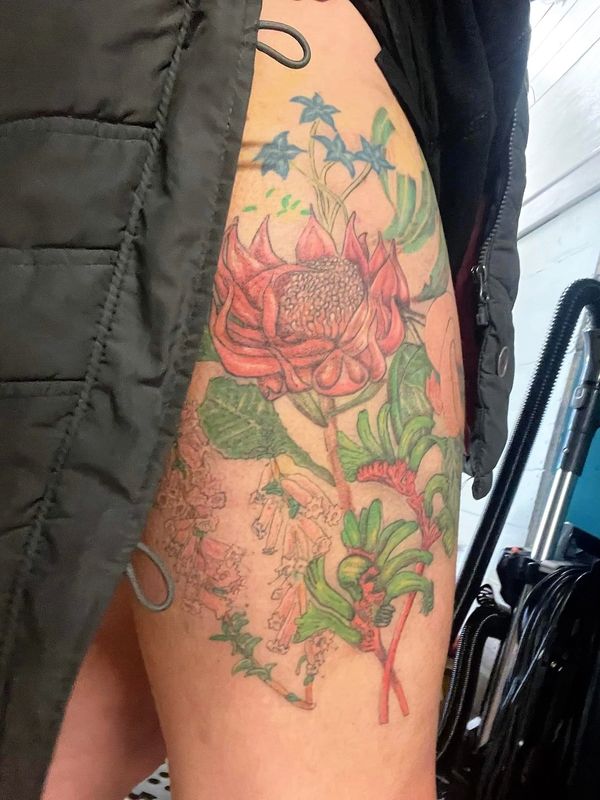 Australian native flowers collage thigh tattoo