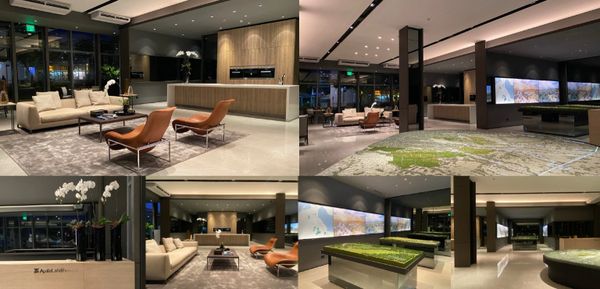 Modern, spacious lobby with stylish seating and large display tables.