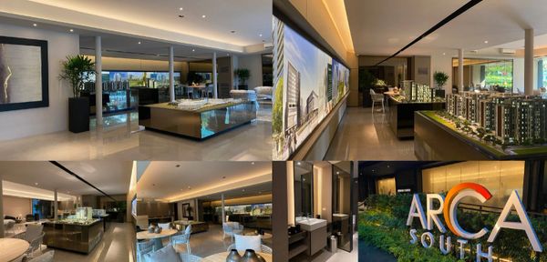 Modern real estate showroom with architectural models and elegant decor.