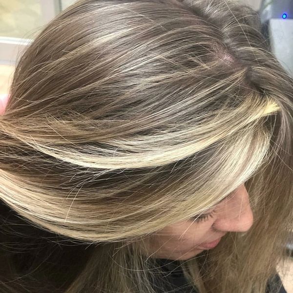 Balayage, face framing and baby lights to create a dimensional haircolor