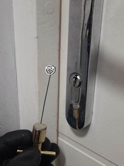 locksmith tool next to locked door