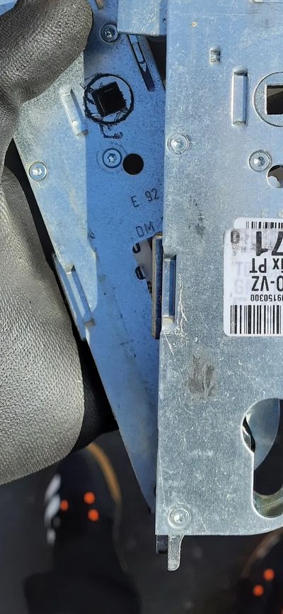 picture with new and broken door multi point lock gearbox