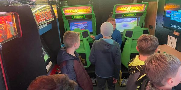 Kids playing Arcade Games inside the Party Trailer.