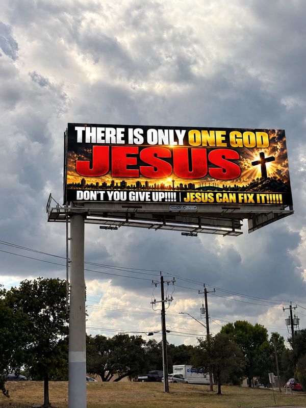 Billboard promoting faith in Jesus as the one true God.