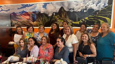 Group of women sit on So far with looking on the camera