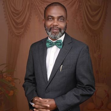 Man in suit with green bow tie.